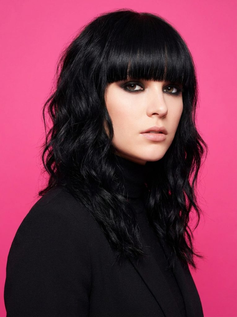 Jet Black Wavy Wolf Cut With Blunt Fringe