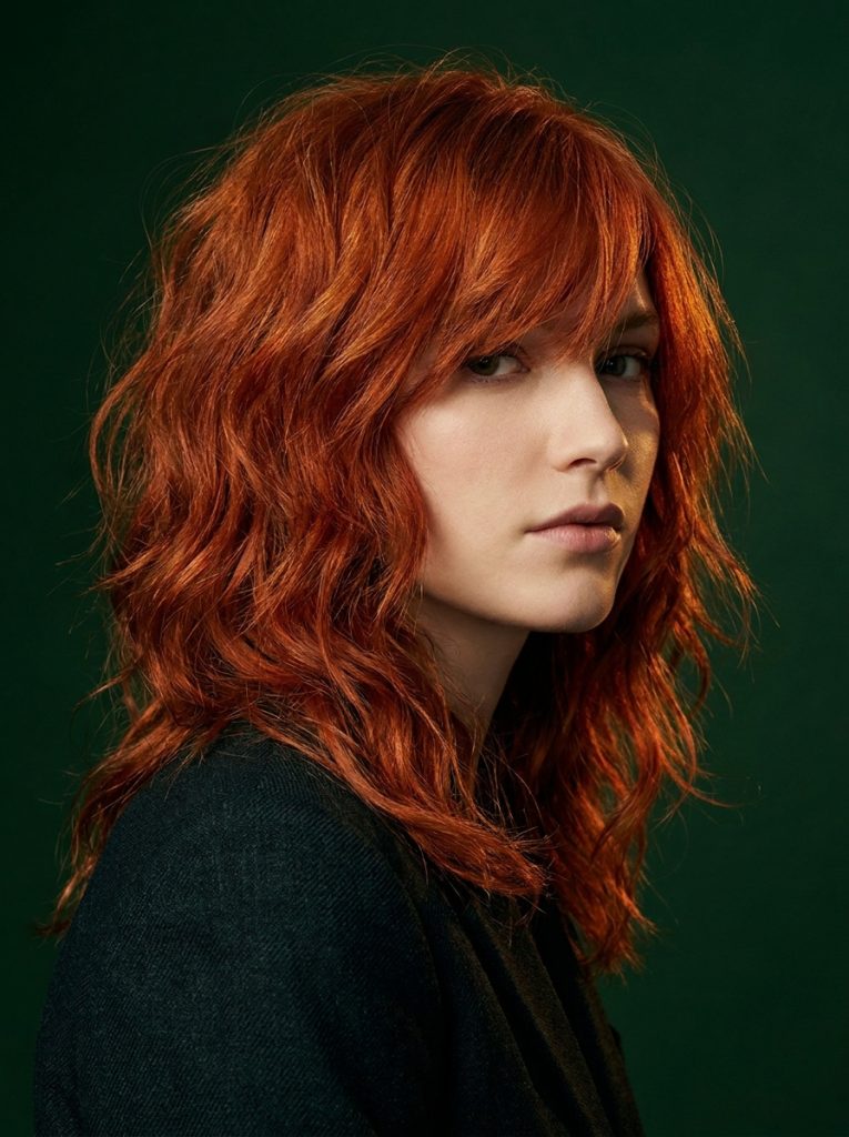 Medium Red Wavy Wolf Cut With Side-Swept Bangs