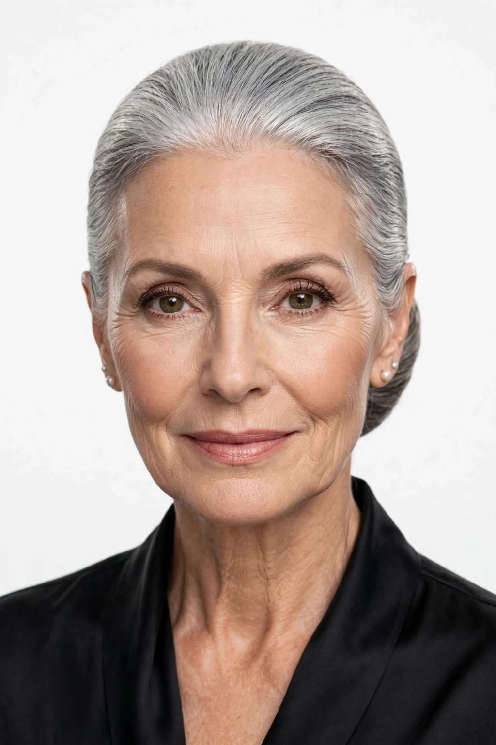 Hairstyles for Women Over 60: 20 Elegant Ideas to Try 13 11. Pulled-Back Bun on Silver Hair